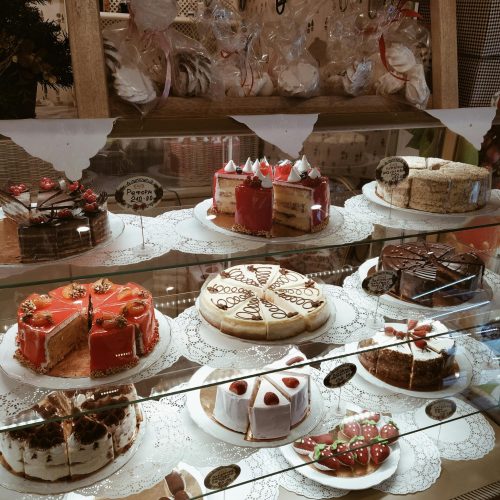 Delicious assorted cakes and pastries on display in a bakery in Tyumen, Russia.